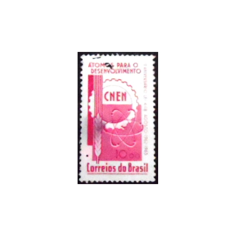 Imagem similar à do selo postal do Brasil de 1963 Átomos para o Desenvolvimento U